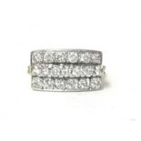 An 18ct gold and diamond panel ring, set with three rows of brilliant cut stones, total diamond