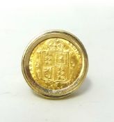 A 9ct gold half sovereign ring, set with a 1892 Old Head shield back coin, weight 9.4 grams.
