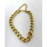 An 18ct gold curb link bracelet, London 1977, with bolt ring clasp, weight 43 grams.