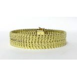 A gold textured double curb link bracelet, stamped 585, weight 42.5 grams.