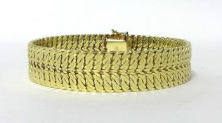 A gold textured double curb link bracelet, stamped 585, weight 42.5 grams.