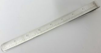 An Edwardian silver Etiquette ruler, by William Hornby, London 1903, engraved with an 8 inch ruler