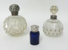 An Edwardian silver mounted, cut glass mounted scent bottle, Birmingham 1911, and two other scent