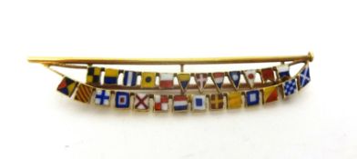 An Edwardian 15ct gold and enamel flag brooch, the mast hoisting the letters of the alphabet, length