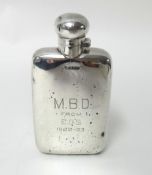 A silver hip flask, Chester 1911, of rectangular form with bayonet cap, inscribed, length 14 cm,