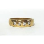 A 9ct gold and diamond four stone ring, star gypsy set with brilliant cut stones, size Y, weight 7