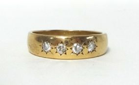 A 9ct gold and diamond four stone ring, star gypsy set with brilliant cut stones, size Y, weight 7