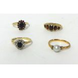 A 9ct gold garnet cluster ring, finger size L 1/2, a 9ct gold five stone garnet ring and two dress