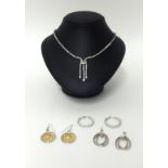 A contemporary silver and paste necklace, and three pairs of silver and paste ear pendants.