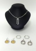A contemporary silver and paste necklace, and three pairs of silver and paste ear pendants.