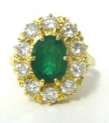Oval emerald and diamond cluster ring, comprising central oval cut emerald, approximately 1.95ct.