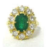 Oval emerald and diamond cluster ring, comprising central oval cut emerald, approximately 1.95ct.