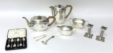 An electroplated four piece tea and coffee service, together with a pair of silver sugar tongs, a