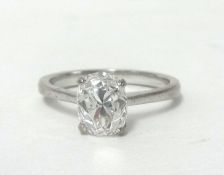 An 18ct white gold single stone diamond ring, claw set with an oval cut diamond weighing