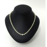 A cultured pearl necklace of graduated form.