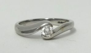 An 18ct white gold single stone diamond ring, twist set with a brilliant cut stone of