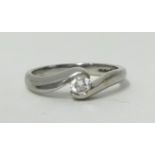 An 18ct white gold single stone diamond ring, twist set with a brilliant cut stone of