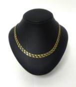 A continental gold necklace, composed of graduated flattened curb links, stamped 585, weight 25