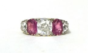 A Victorian gold, ruby and diamond five stone ring, carved claw set with mixed and old cut stones,