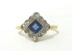 An Art Deco gold, sapphire and diamond cluster ring, milligrain collet set with a square cut stone