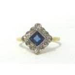 An Art Deco gold, sapphire and diamond cluster ring, milligrain collet set with a square cut stone