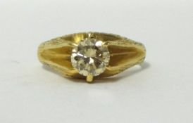 An 18ct gold single stone diamond ring, claw set with a brilliant cut stone, calculated to weigh 1.