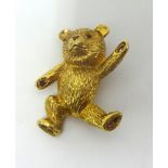 A 9ct gold and ruby Teddy Bear novelty brooch, the naturalistic body set with ruby detailing, height