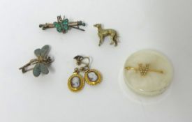 A Victorian gold and half pearl set "A" brooch, a silver gilt brooch of a dog, two butterfly
