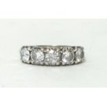 An 18ct white gold five stone diamond ring, claw set with uniform brilliant cut stones of