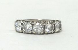 An 18ct white gold five stone diamond ring, claw set with uniform brilliant cut stones of