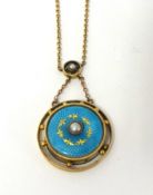 A Victorian gold and enamel pendant, the circular pale blue enamel disc with central pearl, locket