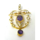 A Victorian gold, amethyst and pearl pendant of openwork scroll design, with a milligrain collet set
