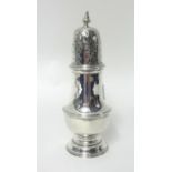 A silver sugar castor, London 1937, of baluster form with a pierced pull-off cover, height 19cm,