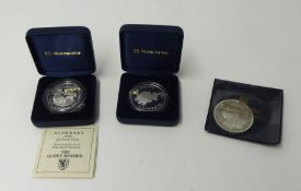 A silver proof Alderney £5 coin, 1995, a silver proof New Zealand $5 coin, 1994 and a silver