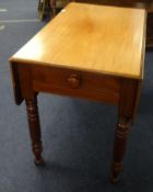 A Victorian mahogany Pembroke table, fitted with a single drawer on turned legs.