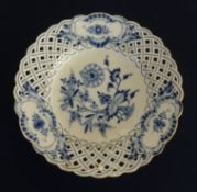 A porcelain blue and white ribbon plate, decorated with flowers, cross swords marks in underglaze