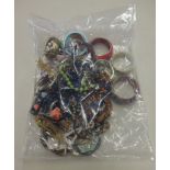 A sealed bag of costume jewellery.