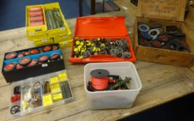 Six yellow metal Meccano boxes with various parts, also a box of clips, and a wood box of tyres.