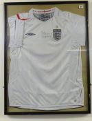 OF FOOTBALL INTEREST England shirt signed Peter Beardsley.