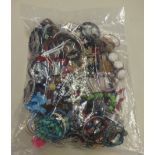 A sealed bag of costume jewellery.