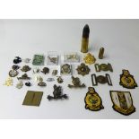 A collection of various original and restrike Cap Badges, Patches etc. Also a WWI pair of medals