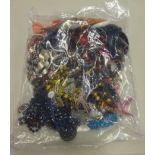 A sealed bag of costume jewellery.