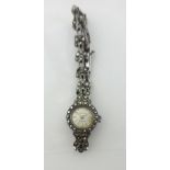 Accurist; A ladies silver and marcasite set wristwatch, with a Y section bracelet.