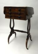 A 19th century rosewood Work Table, fitted with an arrangement of real and dummy drawers to the