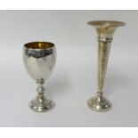 A silver goblet and a spill vase