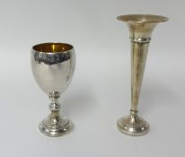 A silver goblet and a spill vase