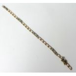 A 9 ct two colour gold curb link bracelet, weight 10.5 grams.