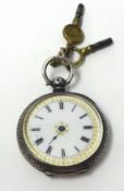 Ladies silver and open face fob watch with Swiss movement, key wound and enamel and gilt dial