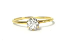 A gold single stone diamond ring, claw set with an old cut stone weighing approximately 0.50cts,