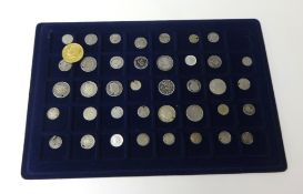 A collection of 40 assorted coin, predominately silver coins, many drilled.